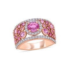 This bold and bright pink sapphire and diamond anniversary band is crafted in lustrous 14-karat rose gold and features 27 round-cut pink sapphires paired with 60 glistening diamonds 1/2 carat (ctw) in a spectacular cluster design, perfect for all occasions. Instantly add a touch of color, elegance and style to any ensemble with this unique gemstone and diamond ring. 2.48 Carat (ctw) Pink Sapphire Ring in 14K Rose Pink Gold with Diamonds Size: 7.5.  Gender: female.  Age Group: adult. Pink Sapphire Diamond Ring, Rose Gold Fashion, Cluster Design, Diamond Anniversary Bands, Cuff Ring, Pink Sapphire Ring, Circle Diamond, Rose Gold Pink, Rose Gold Band