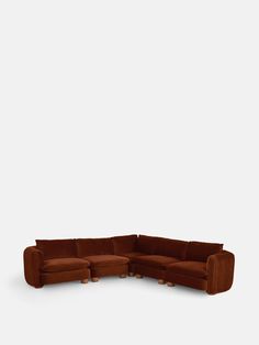 a brown sectional couch with two ottomans on the bottom and an ottoman in the middle