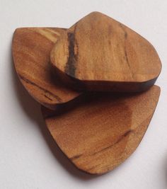 three pieces of wood sitting on top of each other