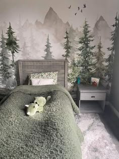 a bed with a green blanket on top of it