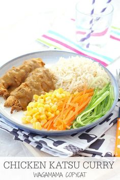 chicken, rice and veggies on a plate with a fork next to it