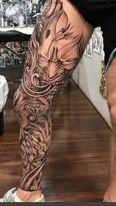 a man's leg with a tattoo on it