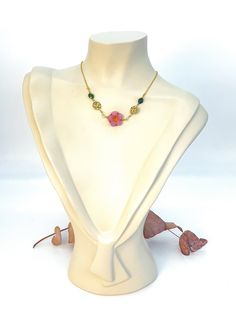 This is a hand crafted necklace design inspired by mao mao's garden party outfit & jewelry from The Apothecary Diaries. This necklace uses 14k-18k gold filled beads/hammered connectors/jump rings/wire, a pink flower czech glass bead, & faceted green jade oval beads.  The necklace is adjustable up to 18 inches (if you need it to be longer just send me a message/or add a note at checkout). Pink Jade Jewelry Gift, Pink Jade Jewelry For Gift, Pink Jade Jewelry As A Gift, Handmade Jade Flower Pendant Necklace, Handmade Jade Necklace With Flower Pendant, Handmade Jade Flower Necklaces, Handmade Flower-shaped Jade Necklaces, Jade Flower Necklace For Gift, Jewelry Anime