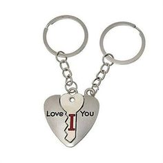 two heart shaped keychains with the words love you and an i on them