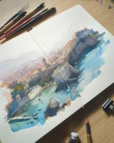 a watercolor painting of a boat in the ocean next to some paintbrushes