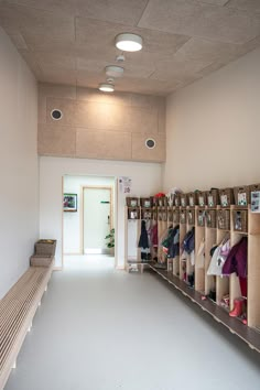 the inside of a room with several shelves and benches