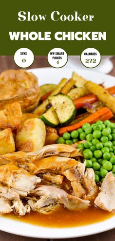 slow cooker whole chicken with peas, potatoes and carrots on a white plate