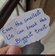 someone holding up a piece of paper that says even the smallest lie can break the biggest trust