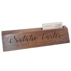 a wooden business card holder with a name tag