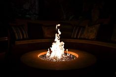 a fire pit lit up in the dark