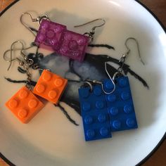 Set Of 3 Pairs Of Real Lego Earrings. Orange Squares Blue Rectangles Purple Sparkle Squares Wear As A Pair, Or Mix And Match. Nwot Lego Earrings, Orange Squares, Lego Jewelry, Orange Square, Purple Sparkle, Earrings Set, Mix And Match, Blue Purple, Earring Set