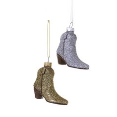 two glitter boots hanging from chains on a white background, one is gold and the other is silver