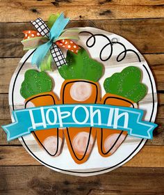 a plate with carrots on it and the words hopon in blue ribbon around them