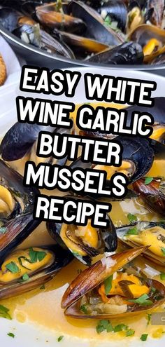 a white plate topped with mussels covered in sauce