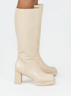 Knee-high boot    Princess Polly Lower Impact   Upper, lining & insole: 100% water-based PU  Outsole: 100% rubber  Faux leather material    Zip fastening at side  Block heel  Square toe  Padded footbed  Heel height:  8.5cm / 3.3in Boots Cream, Cream Shoes, Fleece Dress, Outerwear Outfit, Knee High Leather Boots, Boots Knee, Casual Tank Tops, Tops Fall, Heeled Loafers