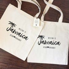 two white bags with the words welcome to jamaica on them