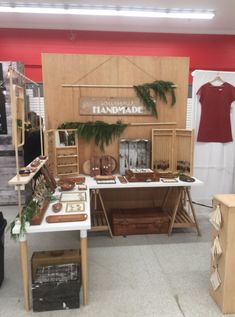 a display in a store filled with lots of wooden furniture and decorating items for sale