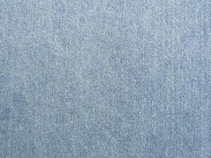 the back side of a pair of jeans with blue denim fabric and white stitching