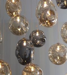 a bunch of glass balls hanging from the ceiling