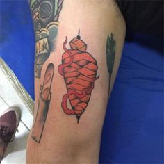 a person with a tattoo on their arm