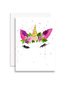 a card with an image of a unicorn's face and flowers on the forehead