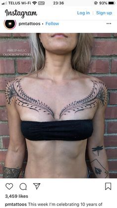 an image of a woman with tattoos on her chest