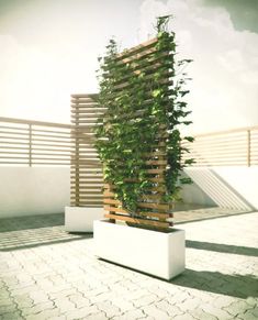 a tall planter sitting on top of a white bench