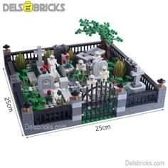 a lego model of a cemetery with tombstones and trees