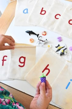 a person is doing crafts with letters and numbers