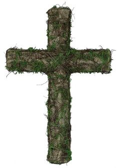 a cross made out of grass on a white background