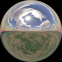 an image of the sky and clouds in a spherical lens