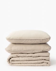 three pillows stacked on top of each other