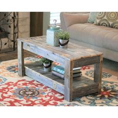 a living room with a couch, coffee table and rug