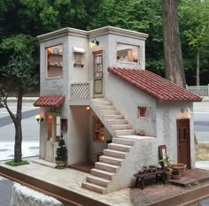 a doll house with steps leading up to it