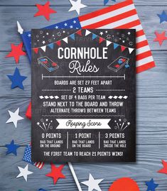 a chalkboard sign that says cornhole rules on it with red, white and blue stars