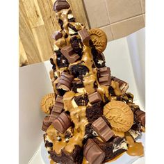 a cake made to look like a christmas tree with cookies and oreos on top