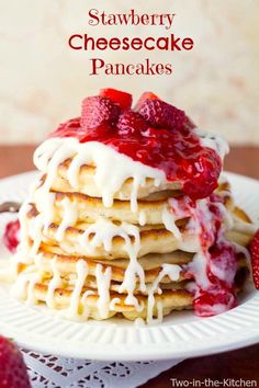 a stack of pancakes with strawberries on top