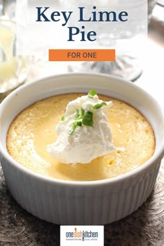 a white bowl filled with food on top of a table