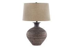 a table lamp with a brown shade on it and a beige linen lampshade