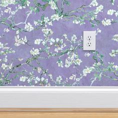 an electrical outlet cover in front of a purple wallpaper with white flowers on it