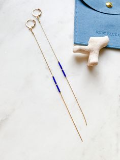 ABOUT THIS PIECE:  Super lightweight pair -  comfortable for all day wear.  Handcrafted sustainable earrings entailing teeny tiny indigo and gold seed bead and 14k gold plated hardware. Approximately 6" long. Versatile pair that can be dressed up or down.  CARE: To preserve your piece, avoid getting water/chemicals on it (e.g. showers/perfume). NOTE: We use standard shipping to mail our orders, this service does not come with a tracking number. If you would like a tracking number or would like y Indigo And Gold, Earring Displays, Lightweight Earrings, Sustainable Jewelry, Dangly Earrings, Beaded Dangle Earrings, Light Weight Earrings, Free Gift Wrapping, Beaded Dangles