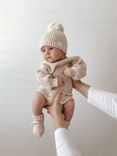 A beautiful newborn romper, with thick cuffs and a relaxed fit around the bodice. Designed to be a timeless keepsake to remember just how teeny, tiny they were. An heirloom piece to pass down to other siblings or a special something to pop in their keepsake box. Matching beanie sold separately. Colour: Oatmeal Fleck. IMPORTANT NOTE ON COLOUR The "Oatmeal Fleck" knitwear range (jumpers, beanies, booties. rompers) have a beautiful coloured sprinkle detail through the knit. The sprinkles are red, g Newborn Knit Romper, Newborn Outfit Ideas, Gender Neutral Newborn Outfit, New Born Outfits, Boy Newborn Outfit, Baby Boy Outfits Newborn, Newborn Baby Boy Outfits