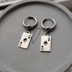 Super trendy lucky ace of spade Huggie hoop earrings in silver!♠️ Would make a great gift for any poker fan! Ear huggies and playing card charms are made of high quality stainless steel so these earrings are hypoallergenic and wont tarnish or discolour. Available as a single earring or as a pair. Hoops measure 17mm Charms measure 10x19mm Please don't hesitate to contact me with any queries or suggestions ☺️ Comes gift wrapped 🎁 Masc Earrings, Accessory Men, Ear Huggies, Man Earrings, Card Earrings, Mens Earrings, Men's Earrings, Earrings Men, Spade Earrings