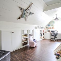 a room with white walls and wooden floors