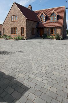 a large brick house with lots of windows