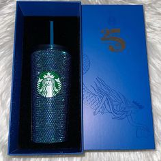 a starbucks cup in a blue gift box