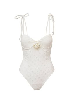 Timeless and sophisticated in the Chamomile One Piece. This must-have one-piece is extra charming, designed with an eyelet fabric and with a floral embossed on the center front. The swimsuit includes underwire for an easy and flattering fit, and self tie thin spaghetti straps. Love Shack Fancy Bathing Suit, Love Shack Fancy Swimwear, Elegant Bathing Suits, Aesthetic One Piece Swimsuit, Coquette Swimsuit, One Piece Swimsuit Aesthetic, Crochet One Piece Swimsuit, Elegant Swimsuit, Cute One Piece Bathing Suits