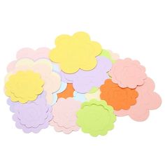 paper flowers are arranged on top of each other in pastel and light pink colors