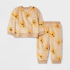 Your baby will stay cozy while looking so adorable dressed in the Disney Winnie the Pooh Cozy Fleece Pullover and Pants Set. Made from fleece fabric, this yellow sweatshirt and jogger pants set provides soft comfort and a snug fit with the ribbed cuffs and hem. The top comes with back snaps for ease of dressing and changing, while the pants feature a full elastic waistband to help keep them in place. Both the pieces are covered with allover Pooh face print for a look that's sure to delight. Bear Pajamas, Toys Ideas, Newborn Boy Clothes, Grey Bodysuit, Christmas Pajama Set, Face Print, Dream Baby, Yellow Sweatshirt, Top And Pants Set