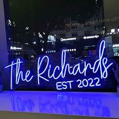 a neon sign that reads the richards est 2020